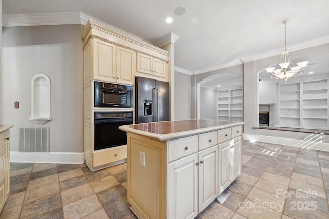 18802 Pentwater Ct, Cornelius, NC 28031 - kitchen featuring oven, high quality fridge, arched walkways, built in shelves, and a chandelier