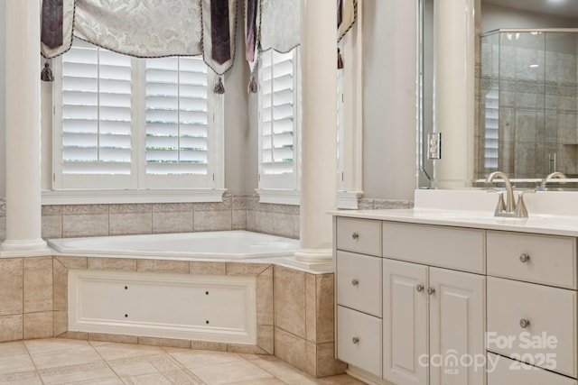 18802 Pentwater Ct, Cornelius, NC 28031 - full bath with decorative columns, vanity, a garden tub, and a stall shower