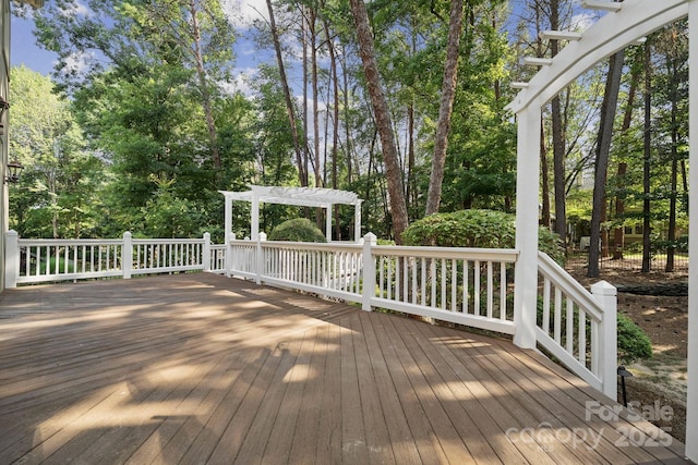 18802 Pentwater Ct, Cornelius, NC 28031 - deck with a pergola and view of wooded area
