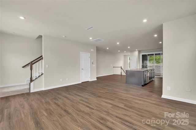 2004 Dornoch Rd, Tega Cay, SC 29708 - unfurnished living room with dark wood-style flooring and recessed lighting