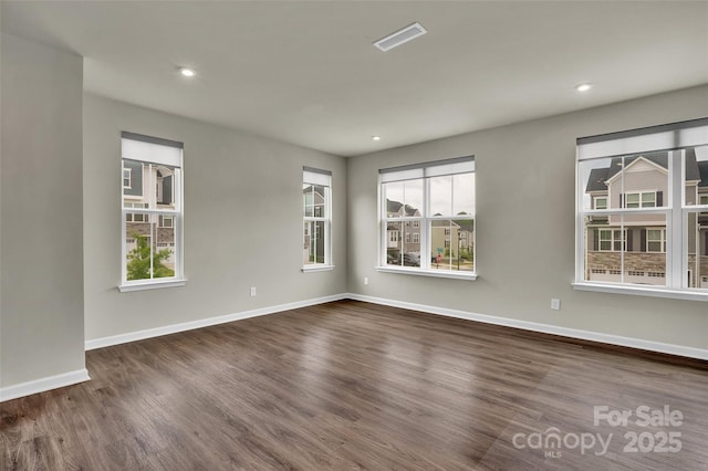 2004 Dornoch Rd, Tega Cay, SC 29708 - spare room featuring dark wood-style floors, plenty of natural light, and recessed lighting