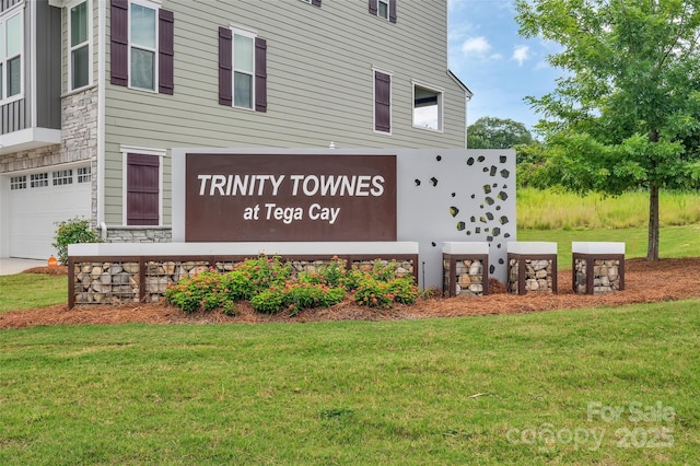 2004 Dornoch Rd, Tega Cay, SC 29708 - community / neighborhood sign featuring an attached garage and a yard