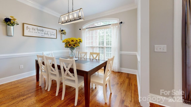 3005 Monterrey Ln, Monroe, NC 28110 - dining space featuring ornamental molding and wood finished floors