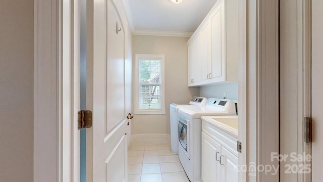 3005 Monterrey Ln, Monroe, NC 28110 - laundry room featuring cabinet space, ornamental molding, washing machine and clothes dryer, and light tile patterned floors