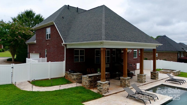 3005 Monterrey Ln, Monroe, NC 28110 - back of house with brick siding, a shingled roof, a fenced backyard, a patio, and a gate