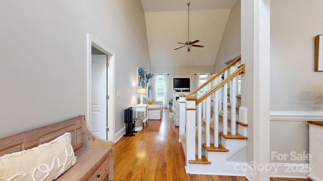 3005 Monterrey Ln, Monroe, NC 28110 - foyer featuring ceiling fan, light wood-type flooring, high vaulted ceiling, and stairway