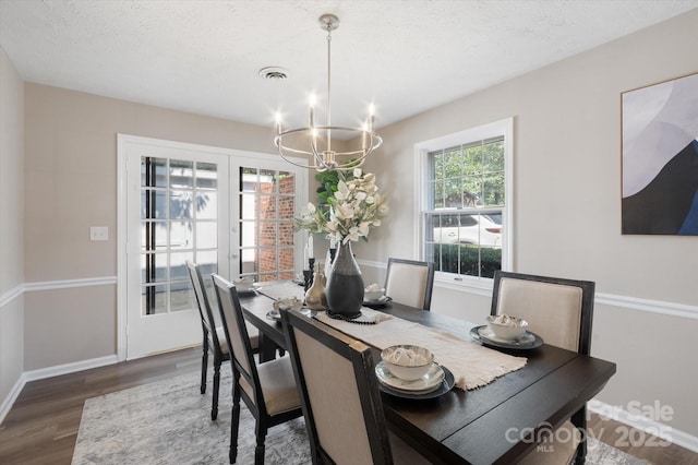 1409 Kensington Rd Unit B-8, Hendersonville, NC 28791 - dining room featuring a chandelier and wood finished floors