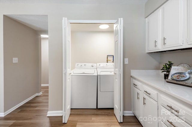 1409 Kensington Rd Unit B-8, Hendersonville, NC 28791 - laundry room featuring washing machine and clothes dryer and light wood-style flooring