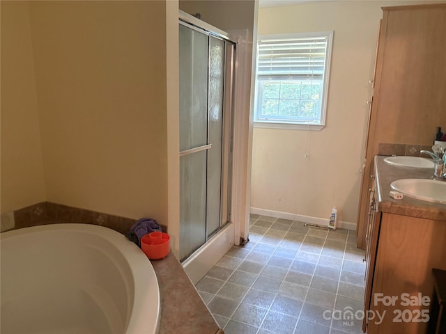 120 Thyme Ln, Statesville, NC 28677 - bathroom featuring a shower stall, double vanity, a bath, and tile patterned floors