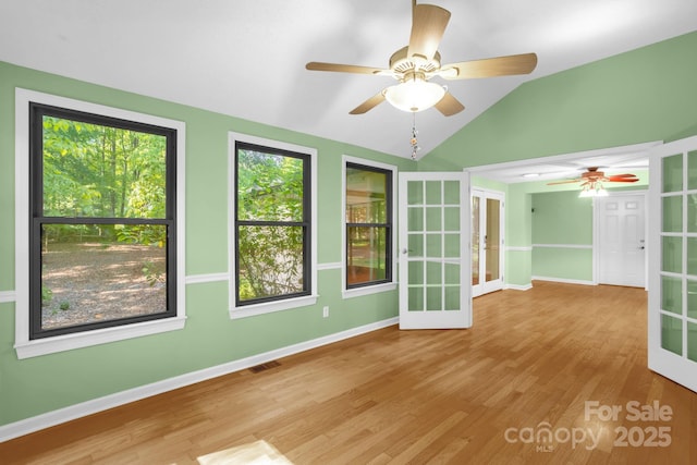 106 Birmingham Pl, Salisbury, NC 28146 - spare room with french doors, ceiling fan, lofted ceiling, and wood finished floors