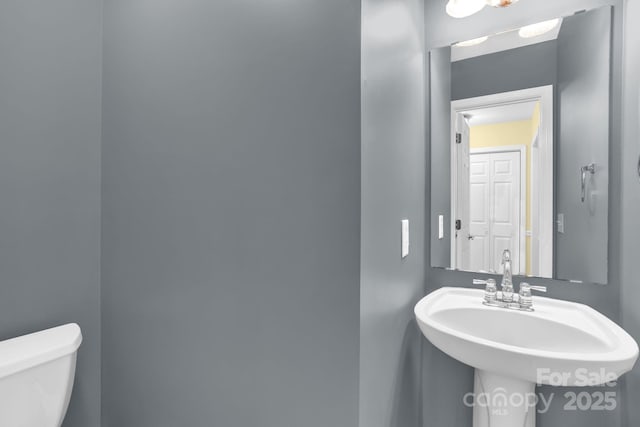 106 Birmingham Pl, Salisbury, NC 28146 - half bathroom with toilet and a sink