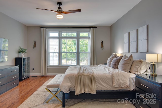 812 Cedar St, Mcadenville, NC 28101 - bedroom featuring light wood-type flooring and a ceiling fan