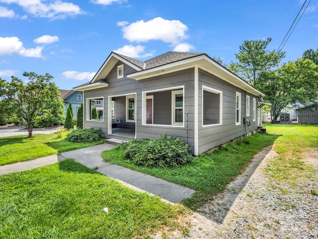 118 Railroad Ave, Brevard, NC 28712 - view of front of house with a porch, a front yard, and a shingled roof