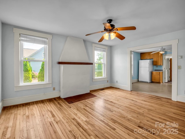 118 Railroad Ave, Brevard, NC 28712 - unfurnished living room with a ceiling fan and light wood finished floors