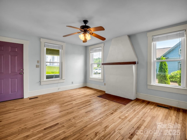 118 Railroad Ave, Brevard, NC 28712 - unfurnished living room with wood finished floors and a ceiling fan