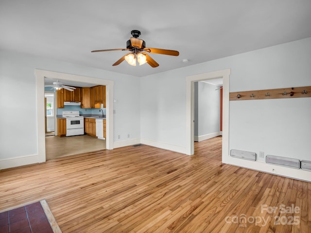118 Railroad Ave, Brevard, NC 28712 - unfurnished living room with ceiling fan and light wood finished floors