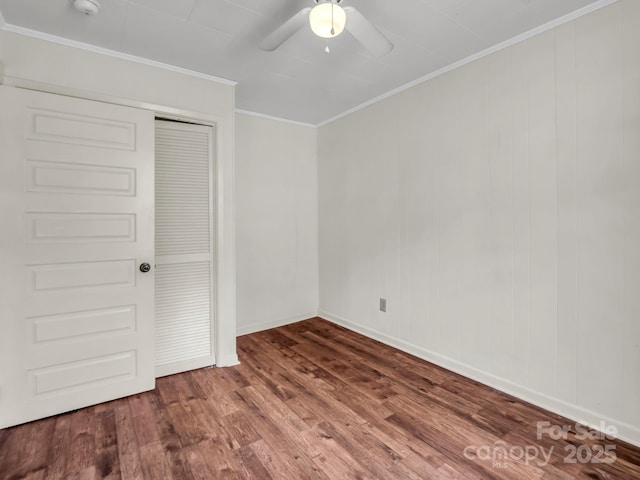 118 Railroad Ave, Brevard, NC 28712 - unfurnished bedroom with wood finished floors, a closet, crown molding, and ceiling fan