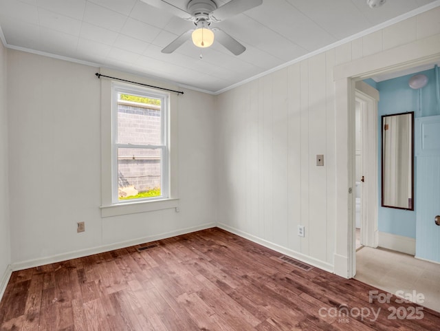 118 Railroad Ave, Brevard, NC 28712 - spare room with crown molding, wood finished floors, ceiling fan, and a smoke detector
