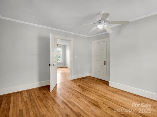 118 Railroad Ave, Brevard, NC 28712 - empty room with ornamental molding, light wood-style flooring, and ceiling fan