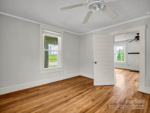 118 Railroad Ave, Brevard, NC 28712 - unfurnished room with ornamental molding, light wood-style floors, and a ceiling fan