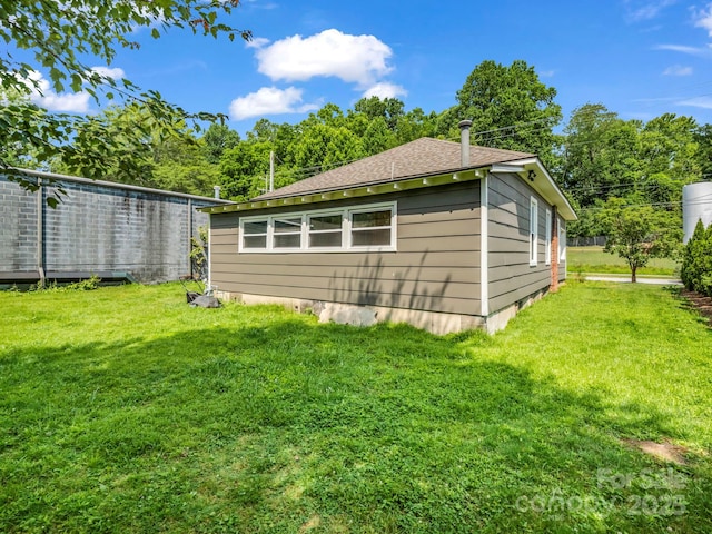118 Railroad Ave, Brevard, NC 28712 - view of home's exterior featuring a lawn and roof with shingles