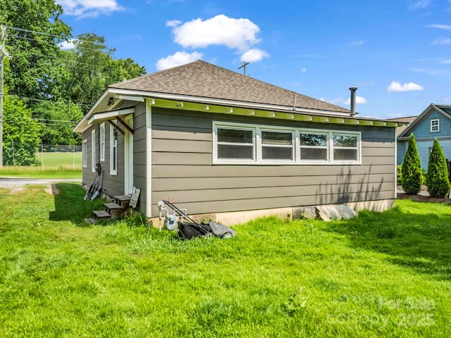 118 Railroad Ave, Brevard, NC 28712 - view of side of home with a lawn, roof with shingles, and entry steps