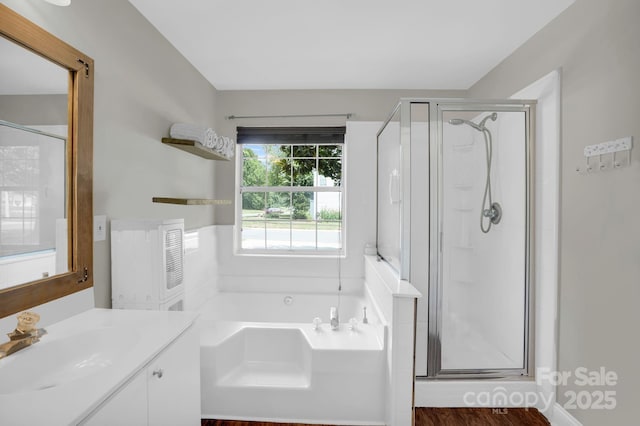 5901 Creft Cir, Indian Trail, NC 28079 - full bath featuring vanity, a shower stall, a bath, and wood finished floors