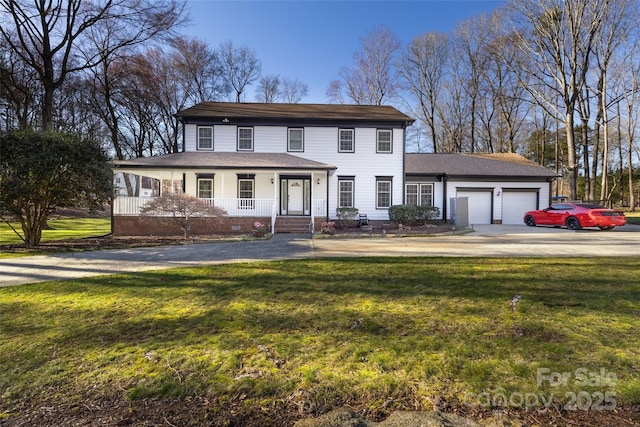 10700 Chestnut Hill Dr, Matthews, NC 28105 - view of front of property with driveway, a porch, a garage, a front yard, and a shingled roof