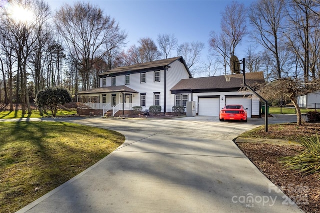10700 Chestnut Hill Dr, Matthews, NC 28105 - view of front of property with a porch, an attached garage, driveway, a front lawn, and roof with shingles