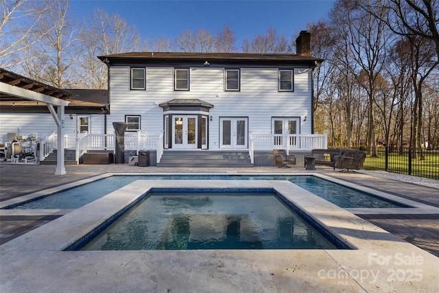 10700 Chestnut Hill Dr, Matthews, NC 28105 - rear view of house with french doors, a chimney, a deck, and a patio