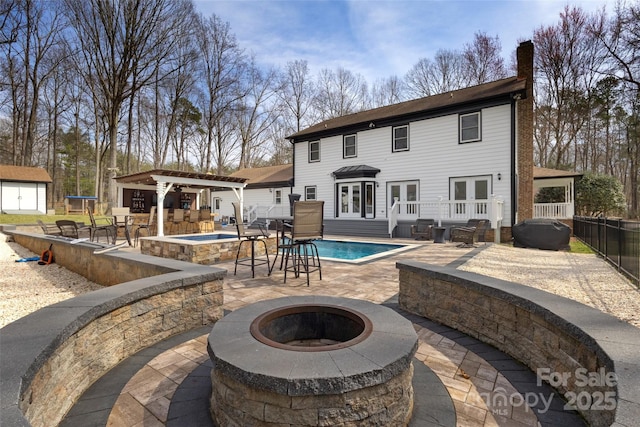 10700 Chestnut Hill Dr, Matthews, NC 28105 - back of house featuring a fire pit, a chimney, a patio, french doors, and a jacuzzi