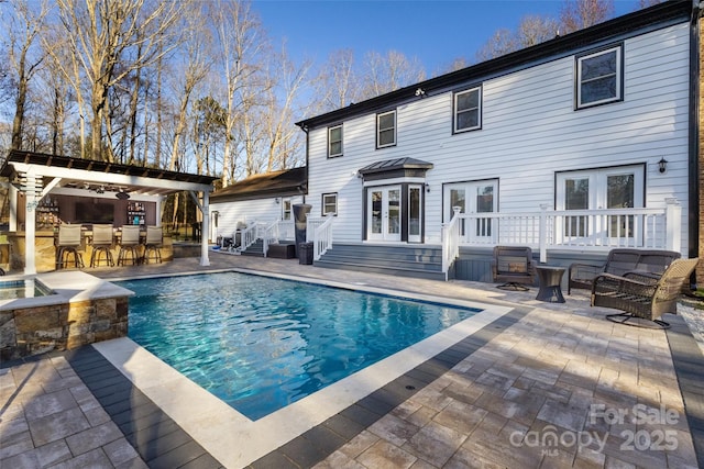 10700 Chestnut Hill Dr, Matthews, NC 28105 - back of property with french doors, an outdoor pool, a patio, and an outdoor hangout area