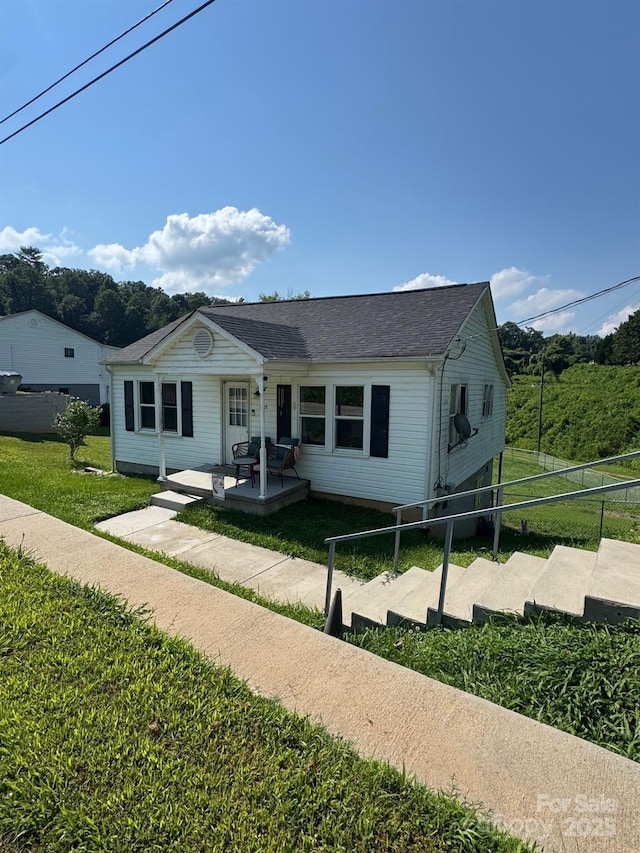 1045 Warren Pl NW, Lenoir, NC 28645 - view of front of home featuring roof with shingles and covered porch