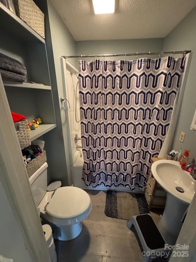 1045 Warren Pl NW, Lenoir, NC 28645 - bathroom with a textured ceiling and shower / bath combo