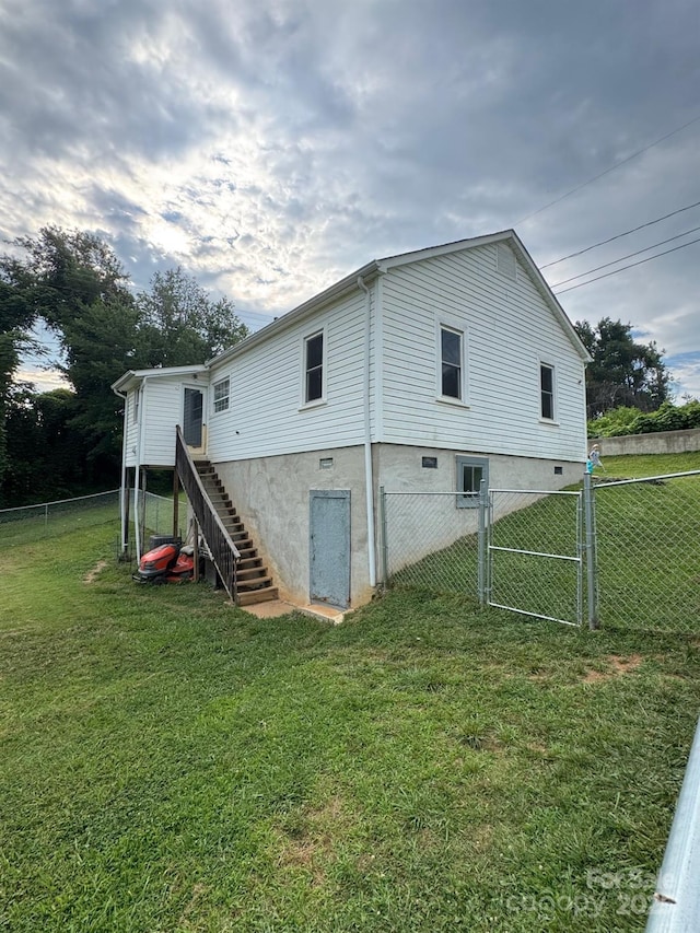 1045 Warren Pl NW, Lenoir, NC 28645 - view of home's exterior with a gate and stairs