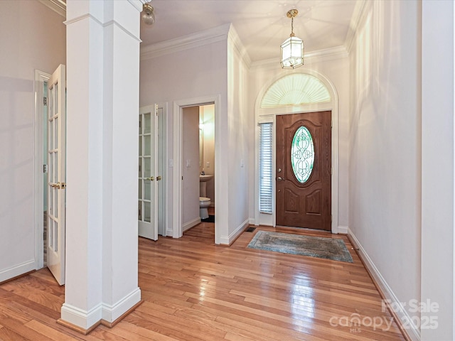 10638 Moss Mill Ln, Charlotte, NC 28277 - entrance foyer with ornamental molding, light wood-type flooring, and ornate columns