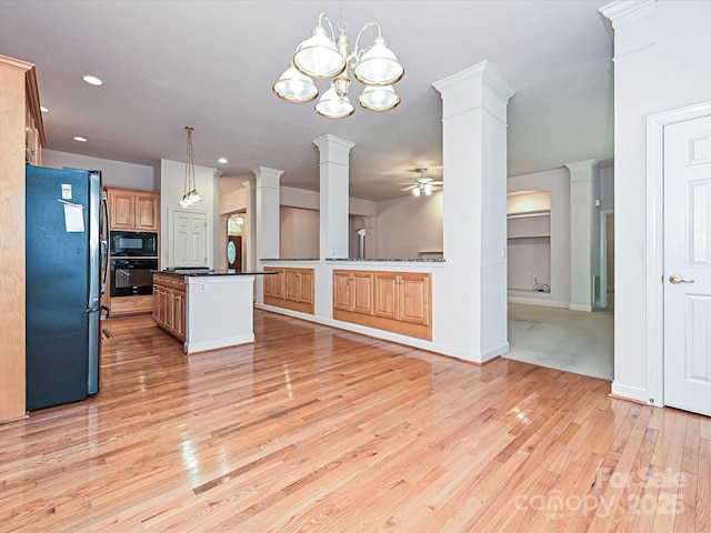 10638 Moss Mill Ln, Charlotte, NC 28277 - kitchen featuring black appliances, ornate columns, a ceiling fan, light wood finished floors, and dark countertops