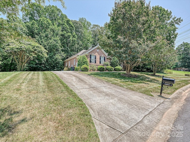 10638 Moss Mill Ln, Charlotte, NC 28277 - ranch-style home with concrete driveway, a front yard, and brick siding