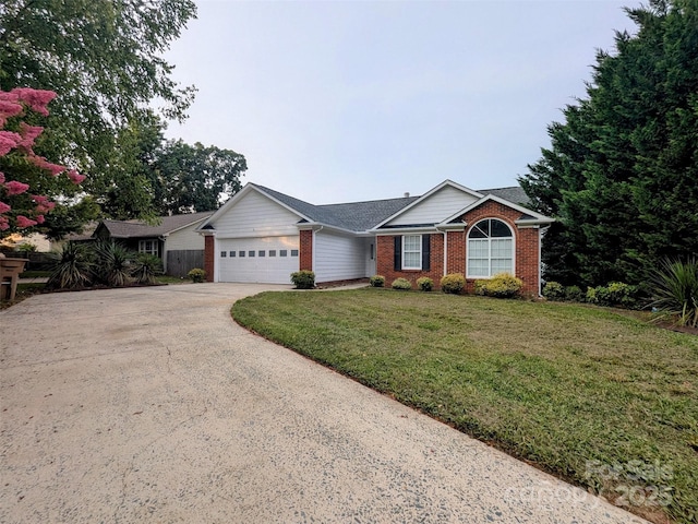 4002 Beaverbrook Dr, Indian Trail, NC 28079 - single story home featuring brick siding, a garage, driveway, and a front yard