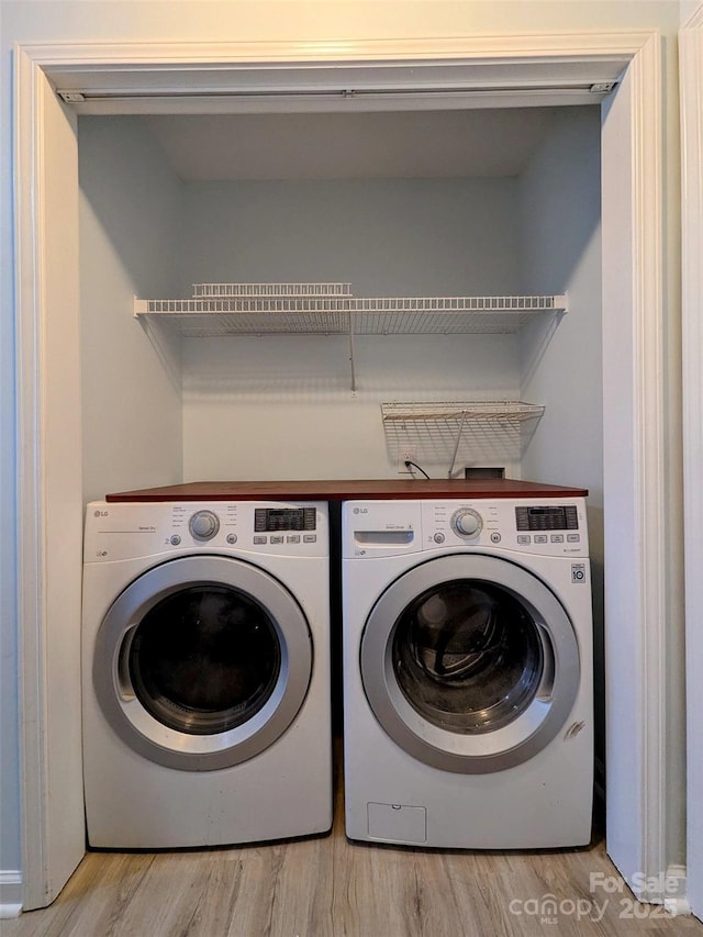 4002 Beaverbrook Dr, Indian Trail, NC 28079 - washroom with washer and dryer and wood finished floors
