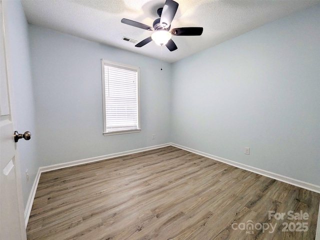 4002 Beaverbrook Dr, Indian Trail, NC 28079 - empty room with wood finished floors, ceiling fan, and a textured ceiling
