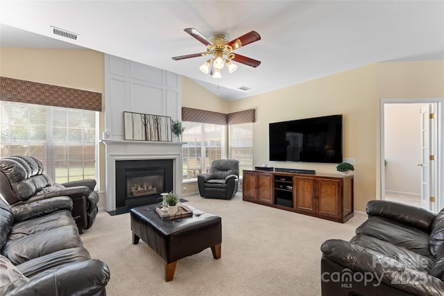 5630 Cambridge Bay Dr, Charlotte, NC 28269 - living area featuring lofted ceiling, ceiling fan, light colored carpet, and a fireplace with flush hearth