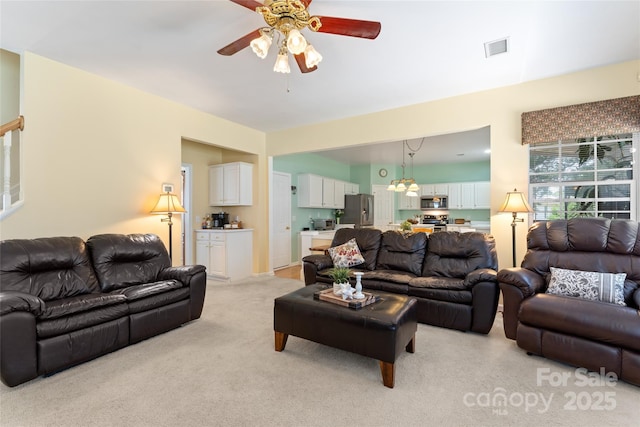 5630 Cambridge Bay Dr, Charlotte, NC 28269 - living room featuring a ceiling fan and light carpet