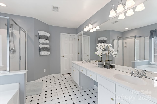 5630 Cambridge Bay Dr, Charlotte, NC 28269 - bathroom with a stall shower, a garden tub, double vanity, and recessed lighting