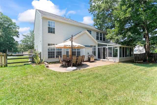 5630 Cambridge Bay Dr, Charlotte, NC 28269 - rear view of house featuring a sunroom, a patio, and a fenced backyard