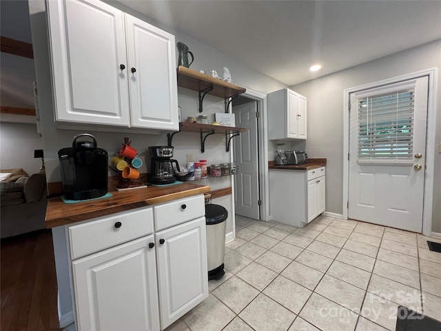 130 Sherwood Dr, Lake Lure, NC 28746 - kitchen featuring butcher block counters, open shelves, white cabinets, light tile patterned flooring, and recessed lighting