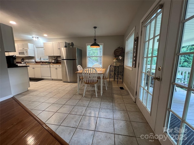 130 Sherwood Dr, Lake Lure, NC 28746 - dining space with recessed lighting and light tile patterned floors
