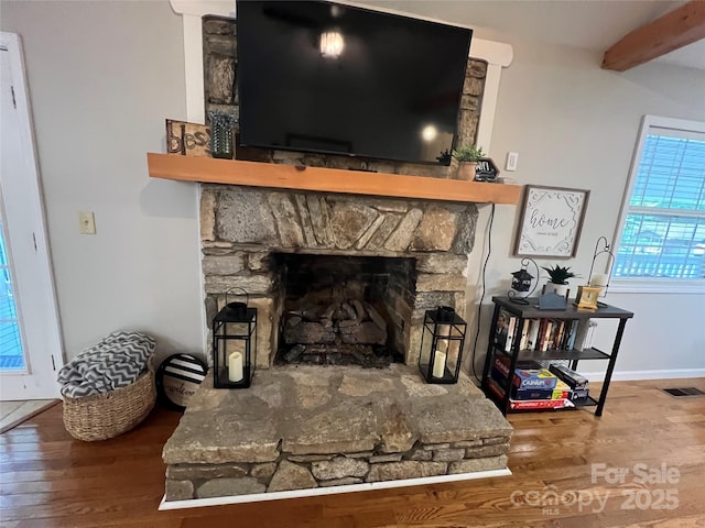 130 Sherwood Dr, Lake Lure, NC 28746 - detailed view of a stone fireplace, wood finished floors, and beam ceiling