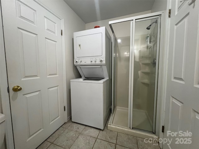 130 Sherwood Dr, Lake Lure, NC 28746 - washroom with estacked washer and dryer and light tile patterned flooring