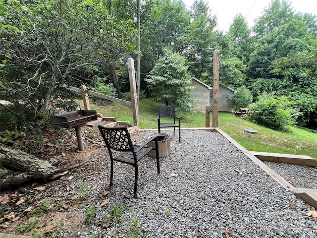 130 Sherwood Dr, Lake Lure, NC 28746 - view of green lawn featuring a fire pit and an outdoor structure